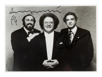 PAVAROTTI, Luciano (1935-2007) -- DOMINGO, Plácido (b. 1941). Black and white photograph, signed (“Luciano Pavarotti” and “Plácido Domingo”), 1994.
