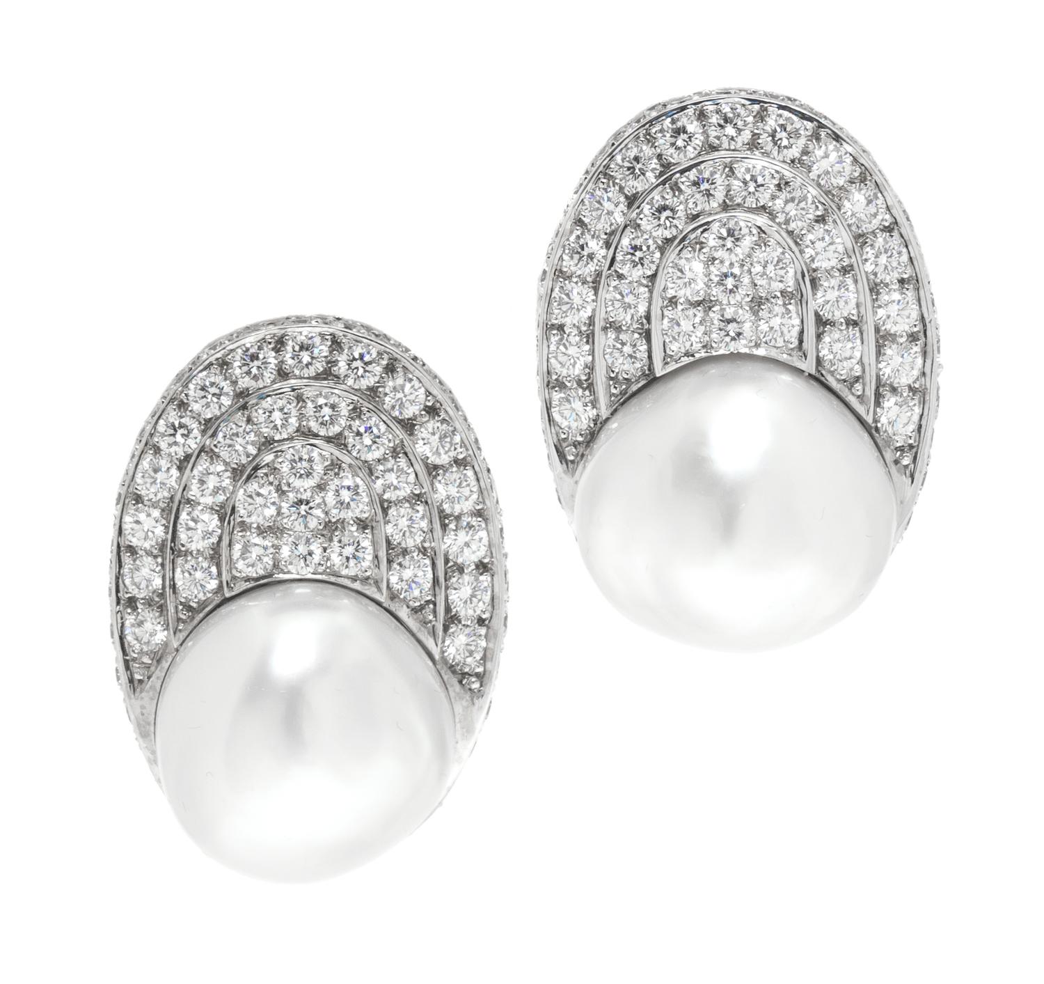 A Pair of White Gold, Cultured Pearl and Diamond Earclips, 22.70 dwts.