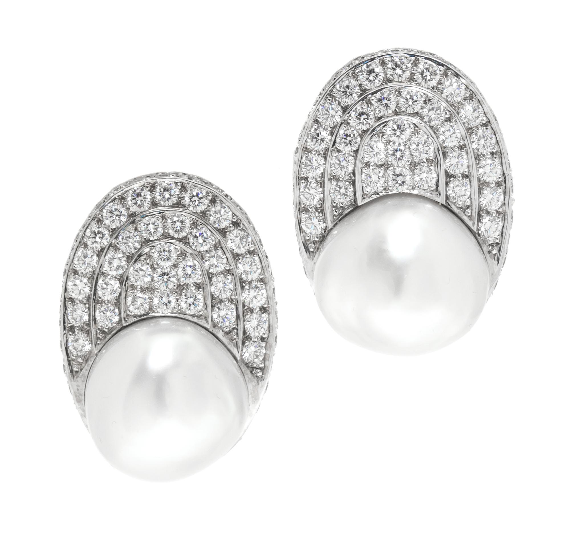 A Pair of White Gold, Cultured Pearl and Diamond Earclips, 22.70 dwts.