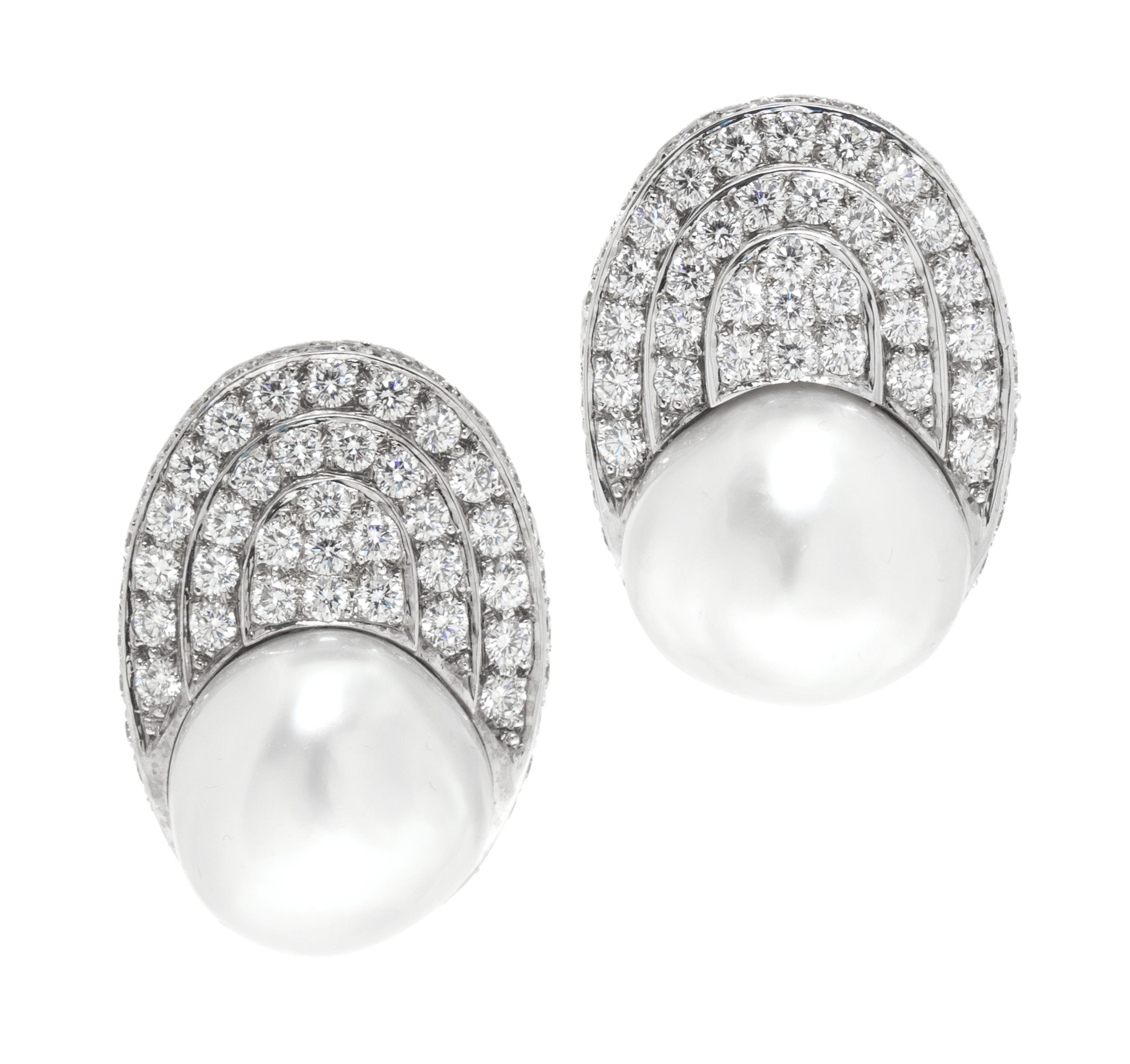 A Pair of White Gold, Cultured Pearl and Diamond Earclips, 22.70 dwts.
