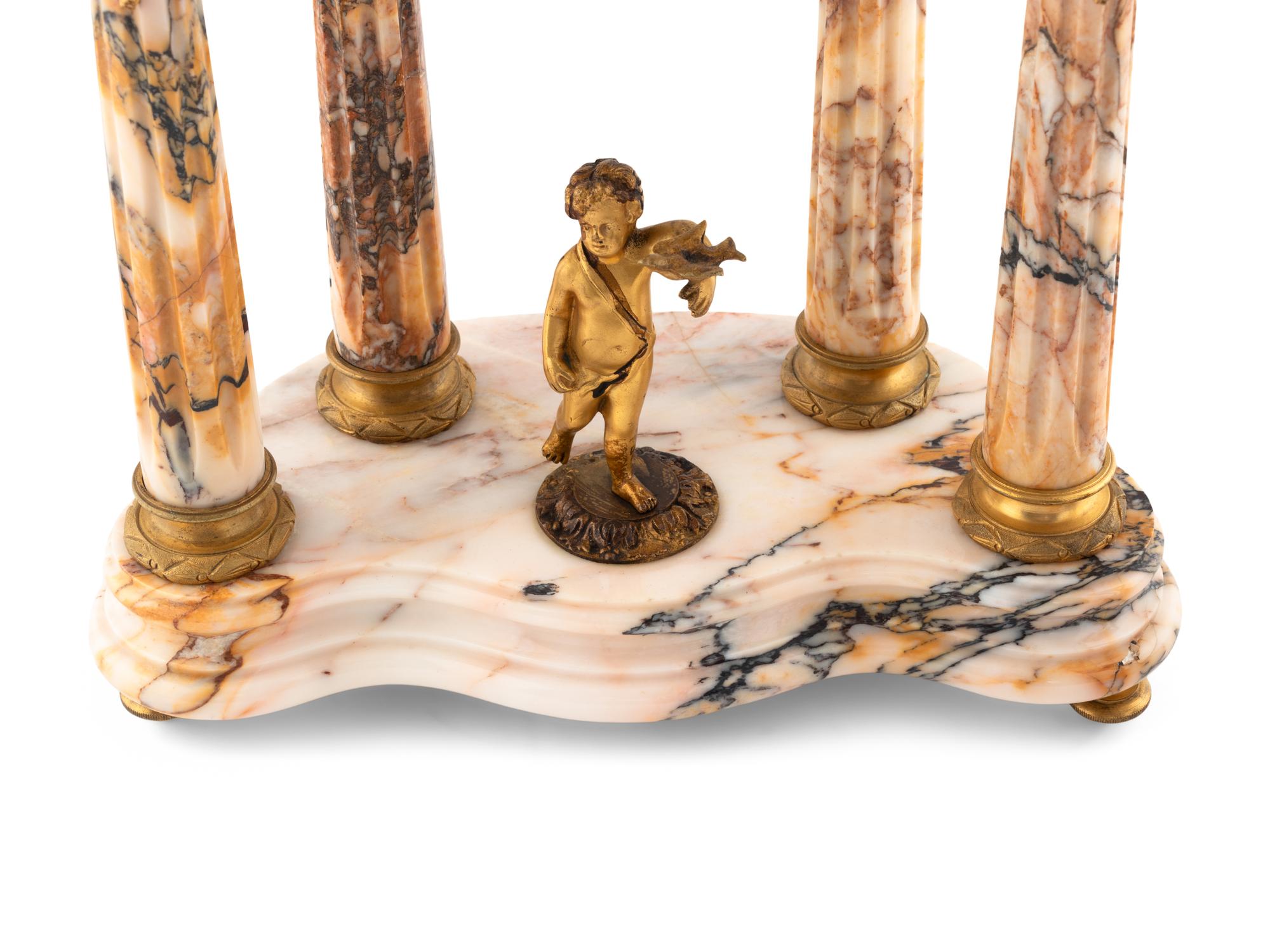 A French Gilt Bronze and Marble Mantel Clock Garniture