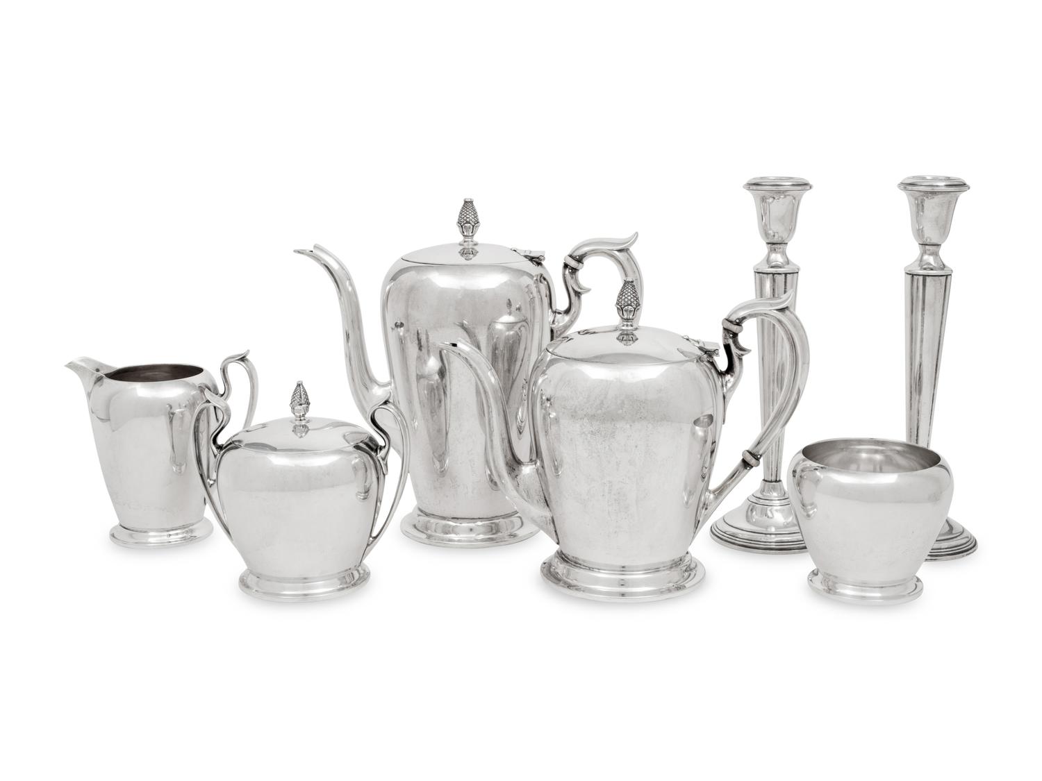 An American Silver Five-Piece Tea and Coffee Service and a Pair of Cartier Silver Candlesticks