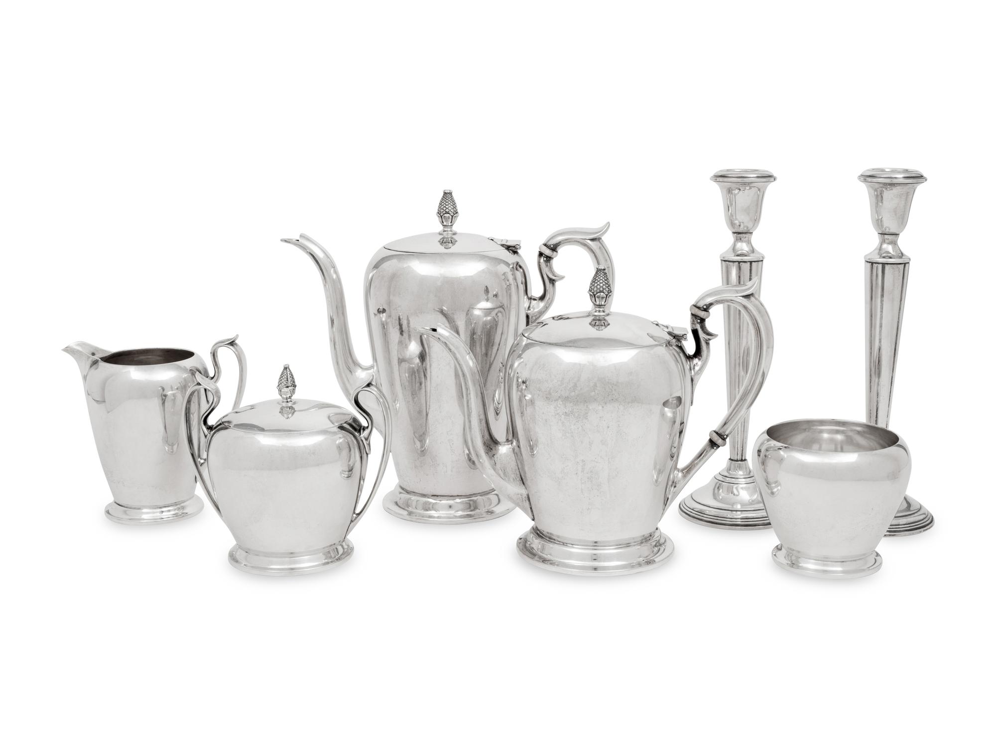 An American Silver Five-Piece Tea and Coffee Service and a Pair of Cartier Silver Candlesticks