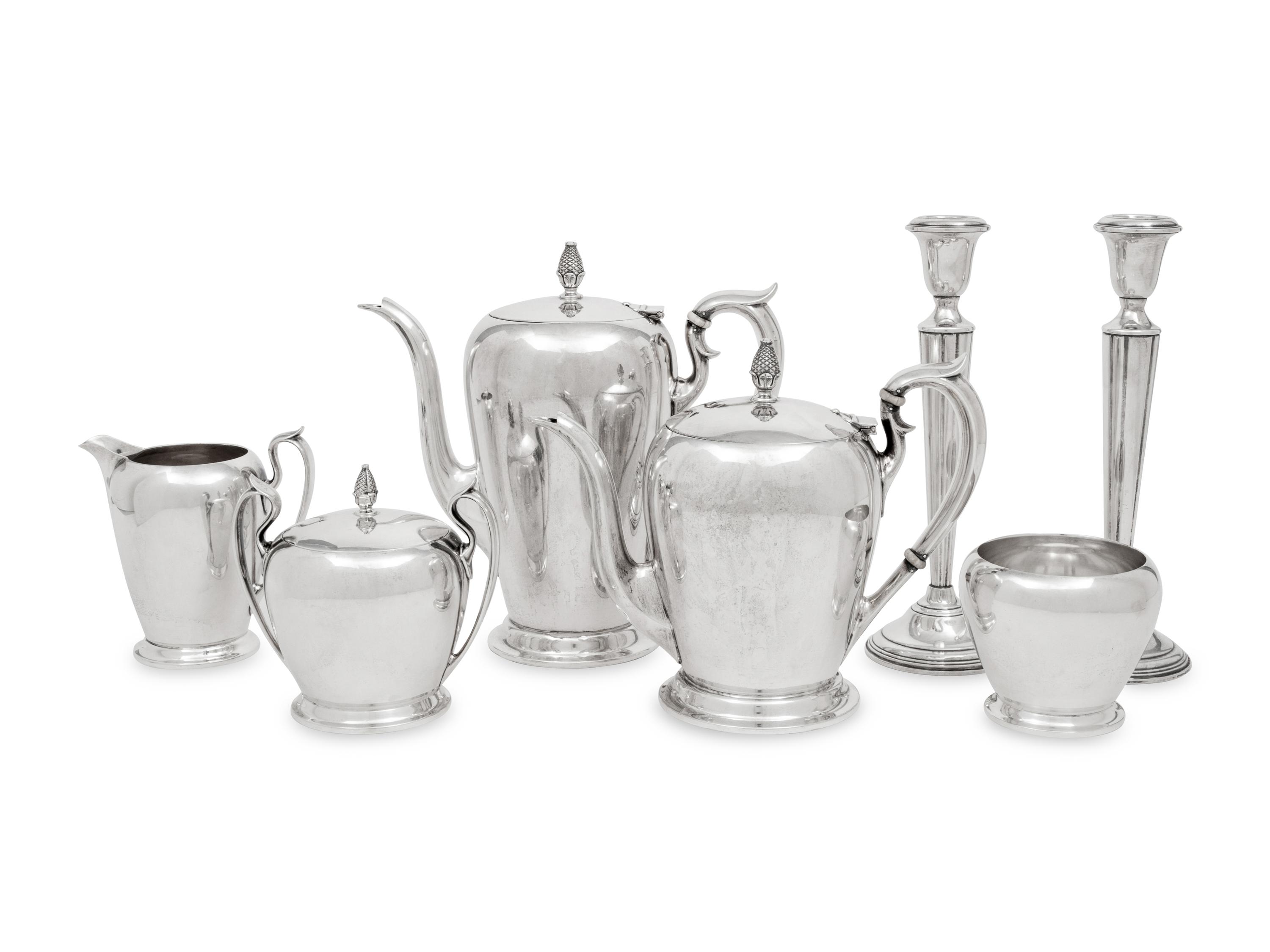 An American Silver Five-Piece Tea and Coffee Service and a Pair of Cartier Silver Candlesticks