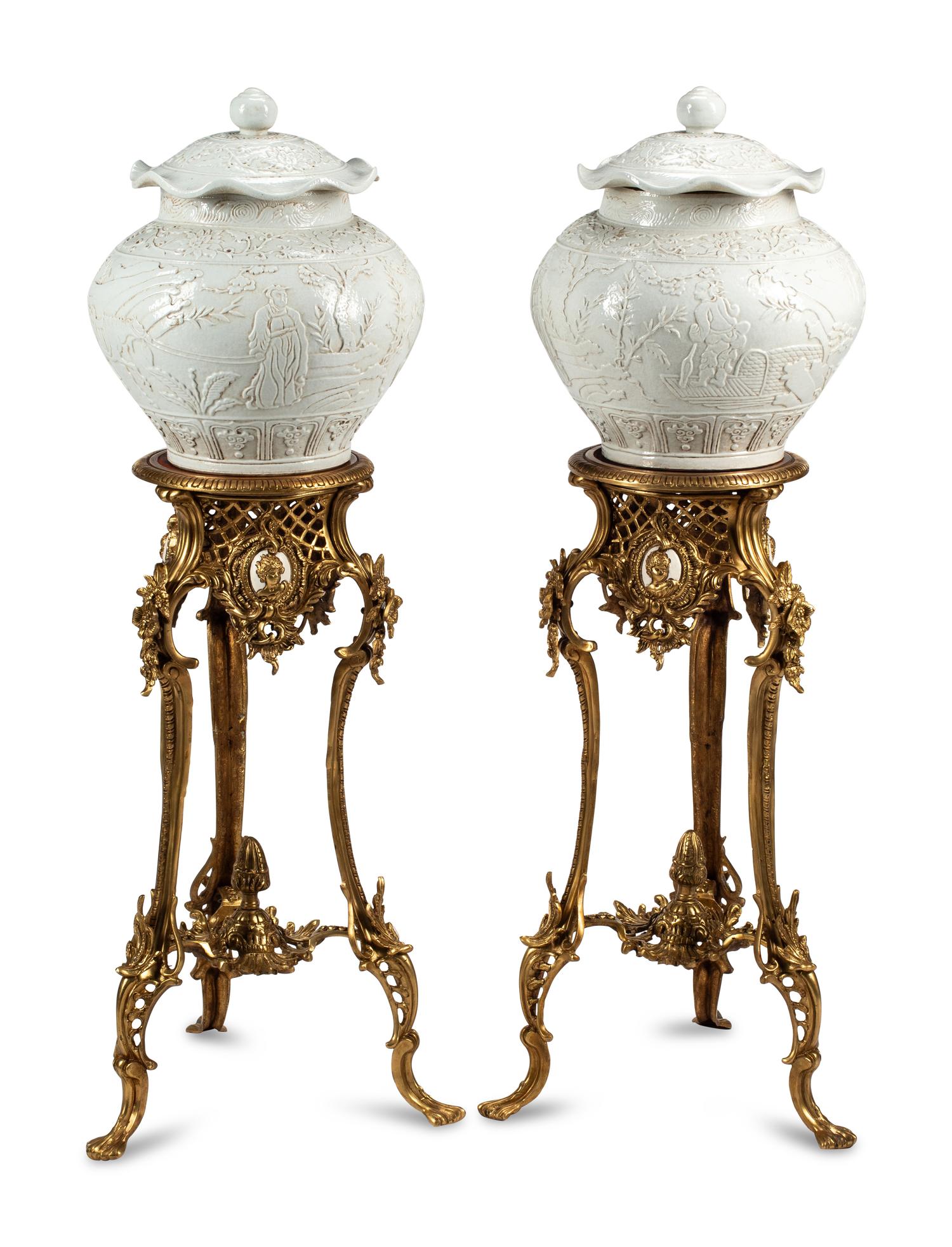 A Pair of Blanc de Chine Porcelain Jars on Gilt Bronze Stands
