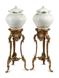 A Pair of Blanc de Chine Porcelain Jars on Gilt Bronze Stands