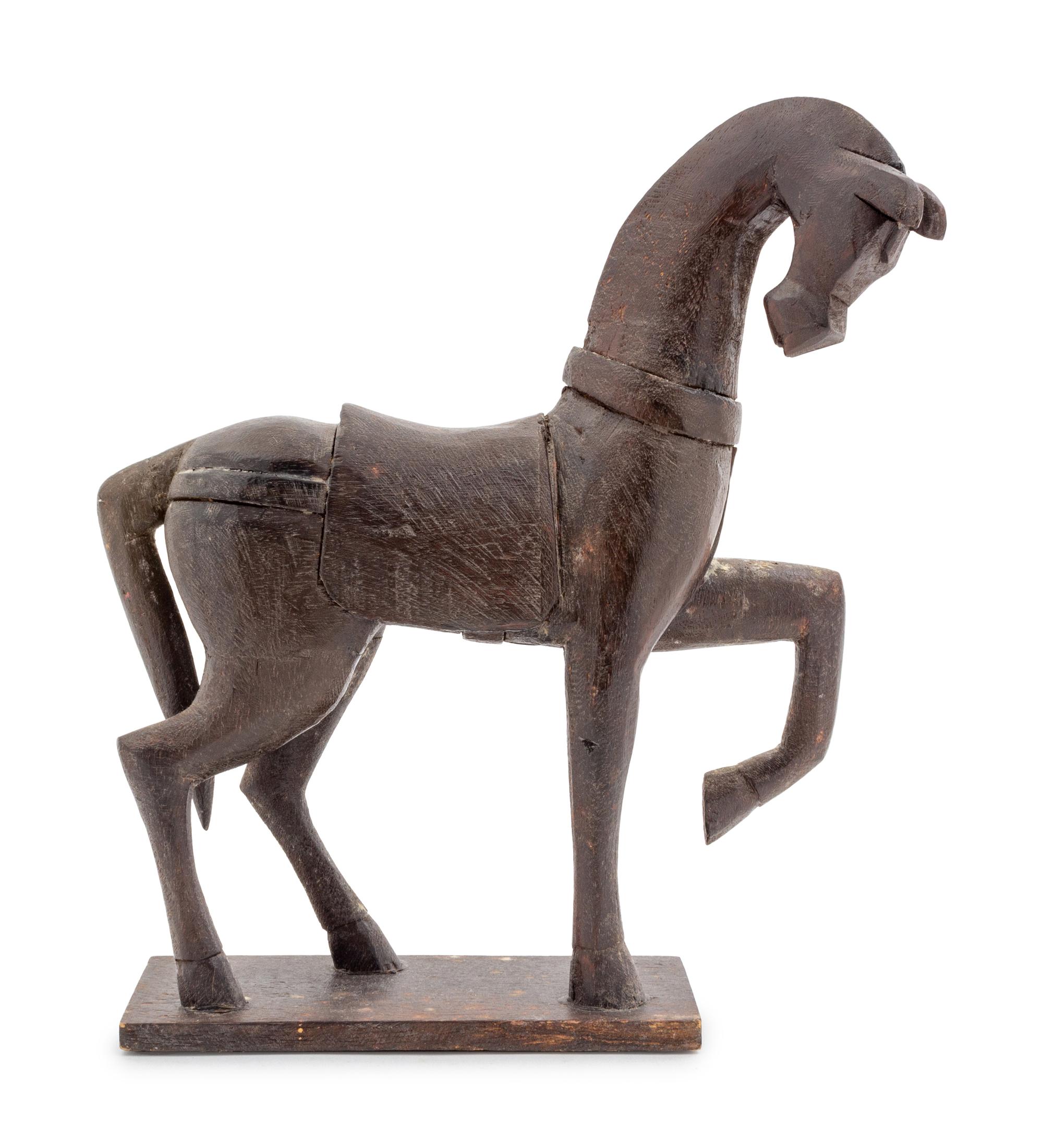 A Carved Wood Model of a Striding Horse