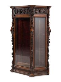 An Italian Renaissance Revival Carved Walnut Cabinet