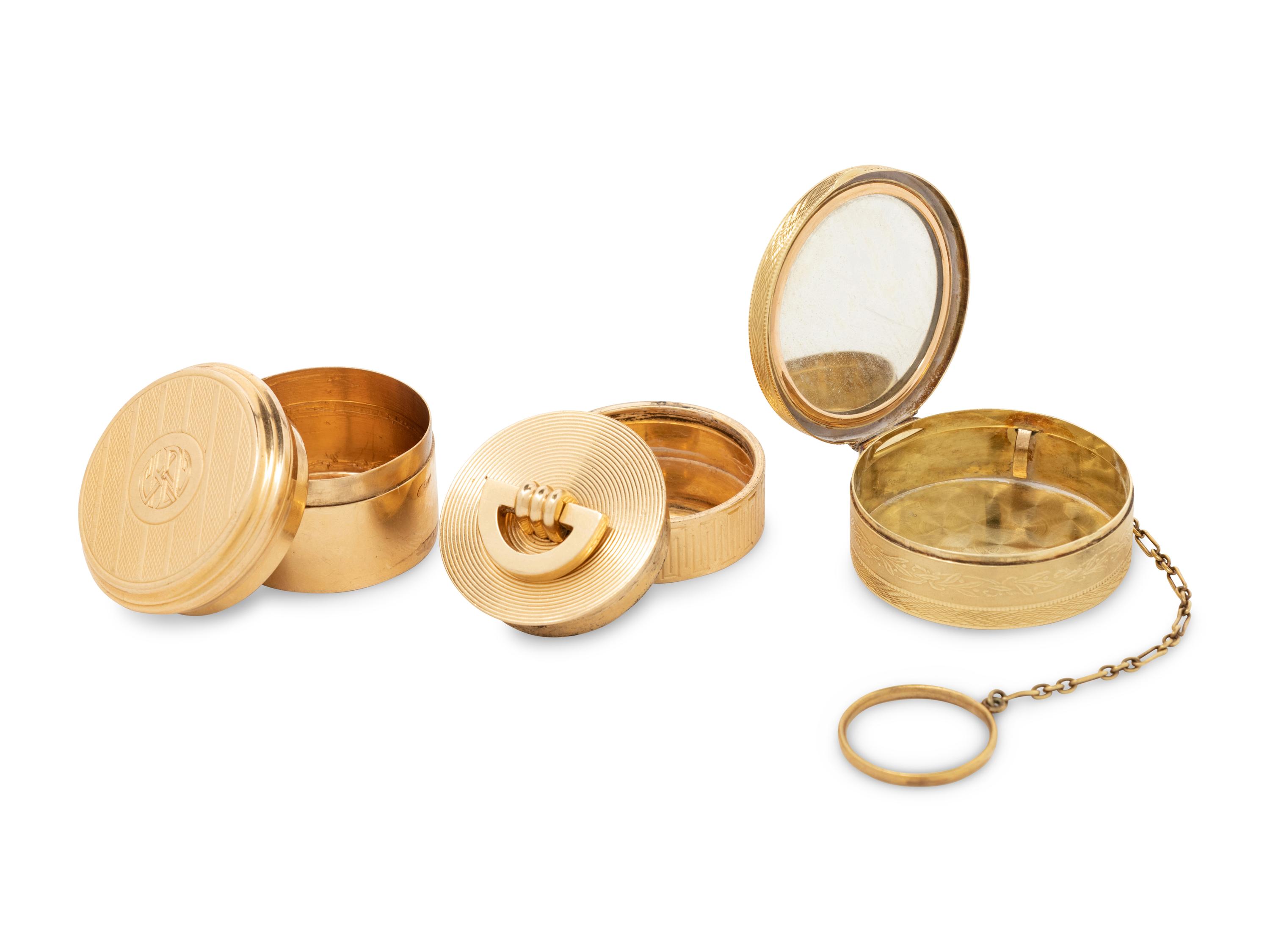 Two Cartier Gold Pill Boxes and Another Gold Pill Box