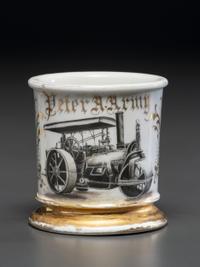 A Porcelain Shaving Mug Depicting a Steam Roller