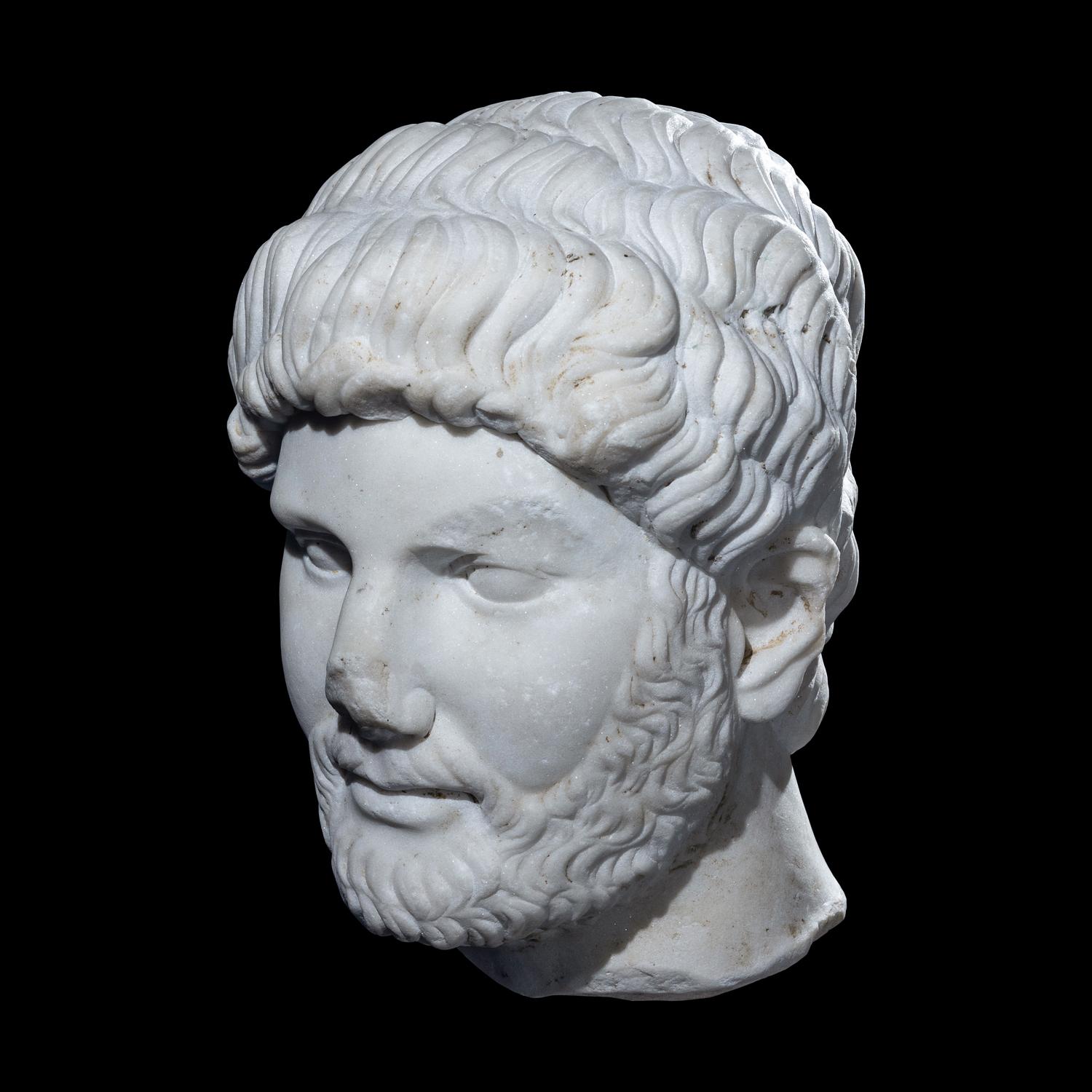 An Over Life-Size Roman Marble Portrait Head of Emperor Hadrian