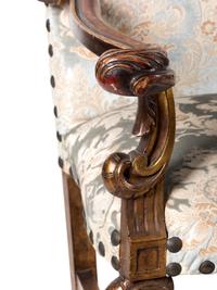 A Pair of Italian Baroque Style Parcel Gilt Walnut Armchairs