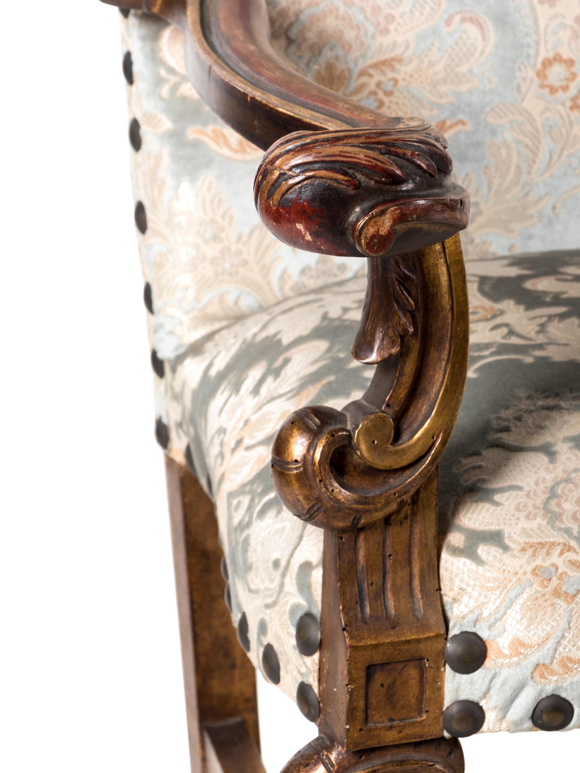 A Pair of Italian Baroque Style Parcel Gilt Walnut Armchairs