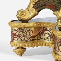 A Louis XIV Ormolu-Mounted Brass-Inlaid Red Tortoiseshell Boulle Marquetry Mantel Clock on Stand* 18th century with later alterations and additions, Louis Mynuel (French, 1675-1742)