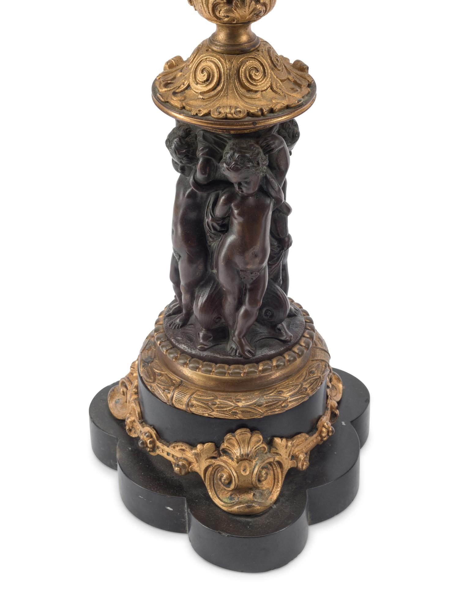 A Pair of French Gilt and Patinated Bronze Five-Light Candelabra