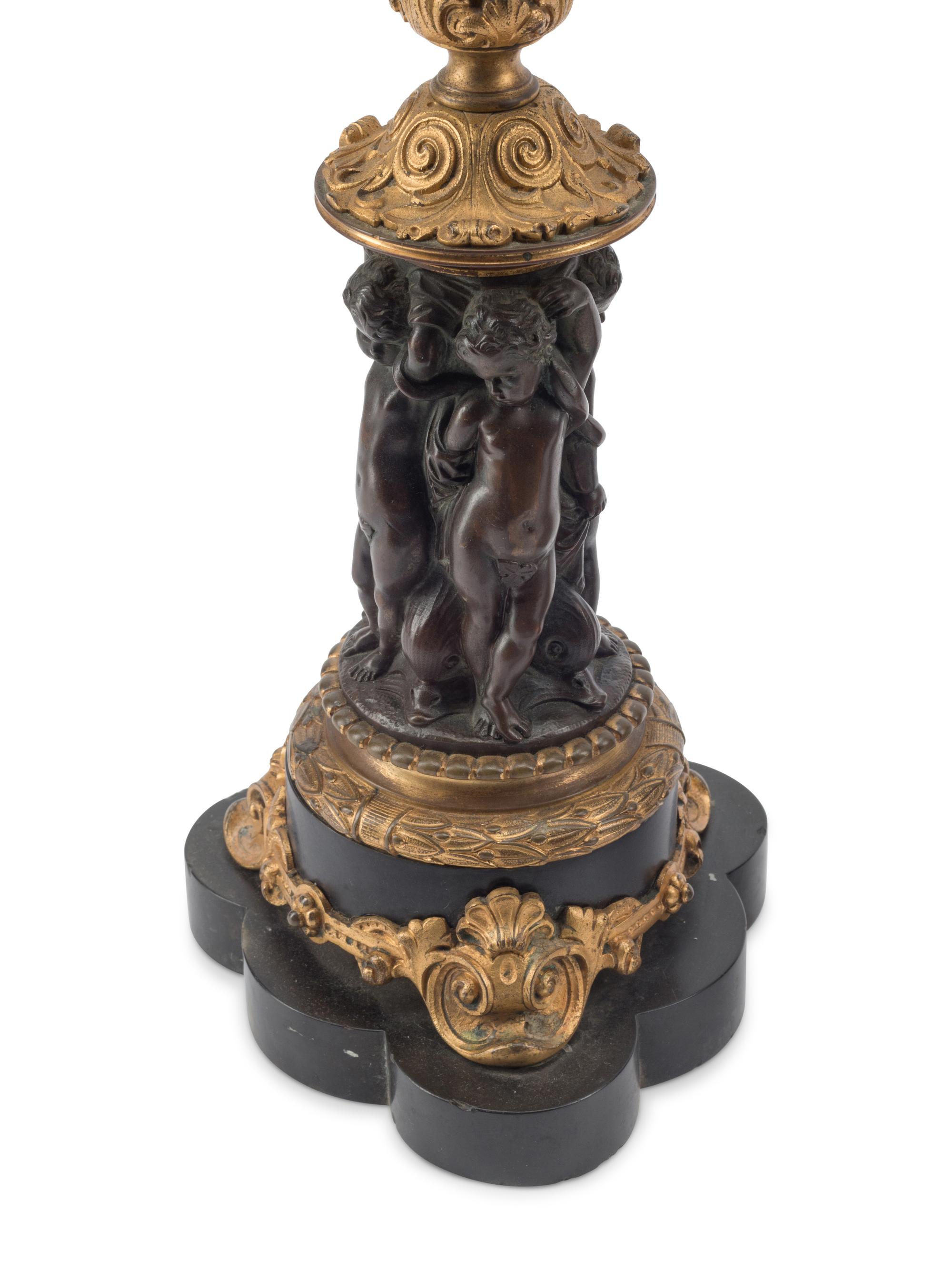 A Pair of French Gilt and Patinated Bronze Five-Light Candelabra