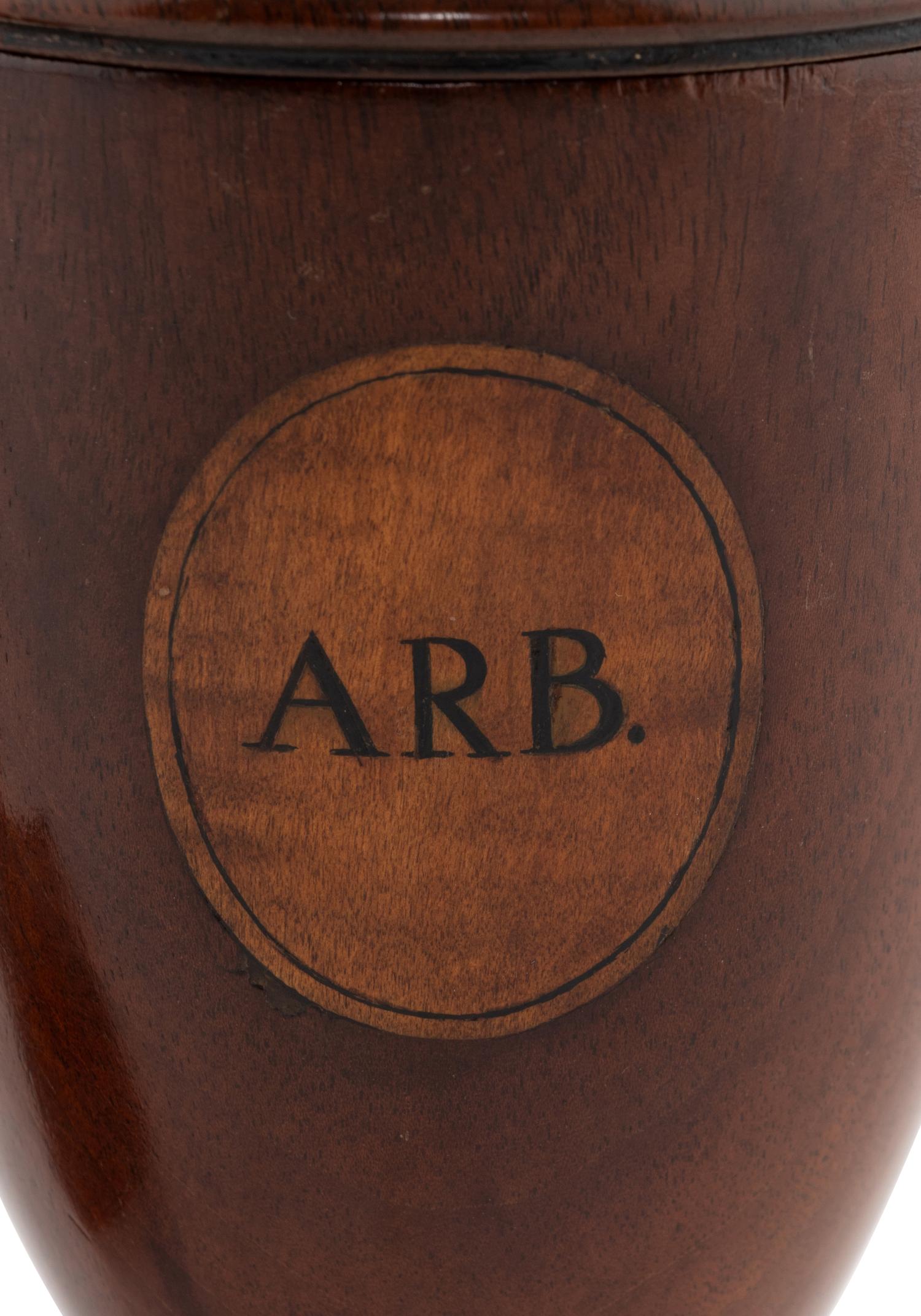 A Pair of George III Mahogany Alms Urns