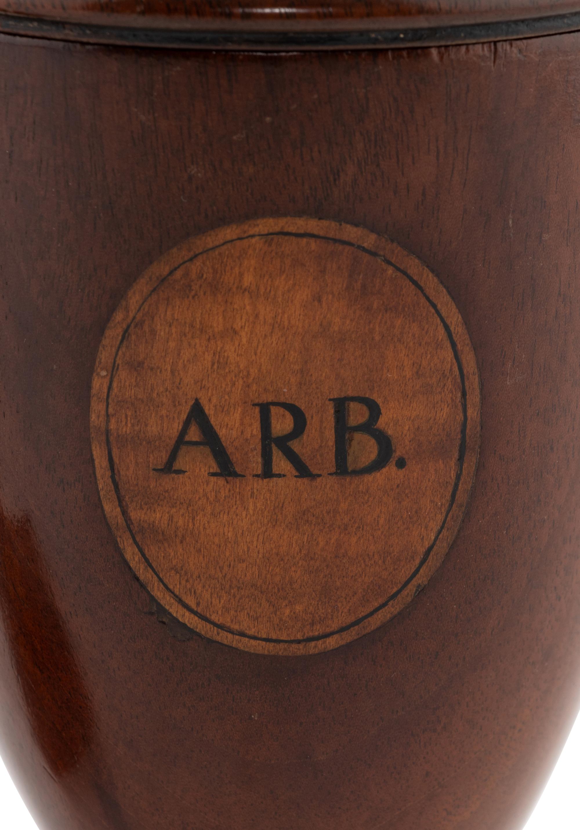A Pair of George III Mahogany Alms Urns