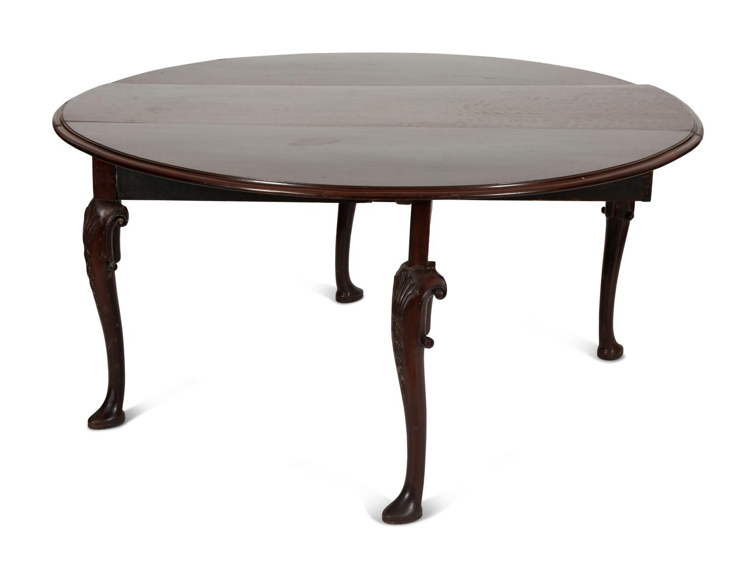 An Irish George II Style Carved Mahogany Drop Leaf Dining Table