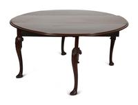 An Irish George II Style Carved Mahogany Drop Leaf Dining Table