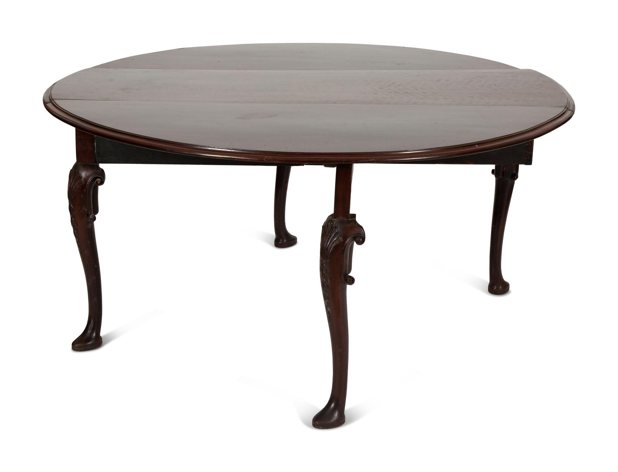 An Irish George II Style Carved Mahogany Drop Leaf Dining Table