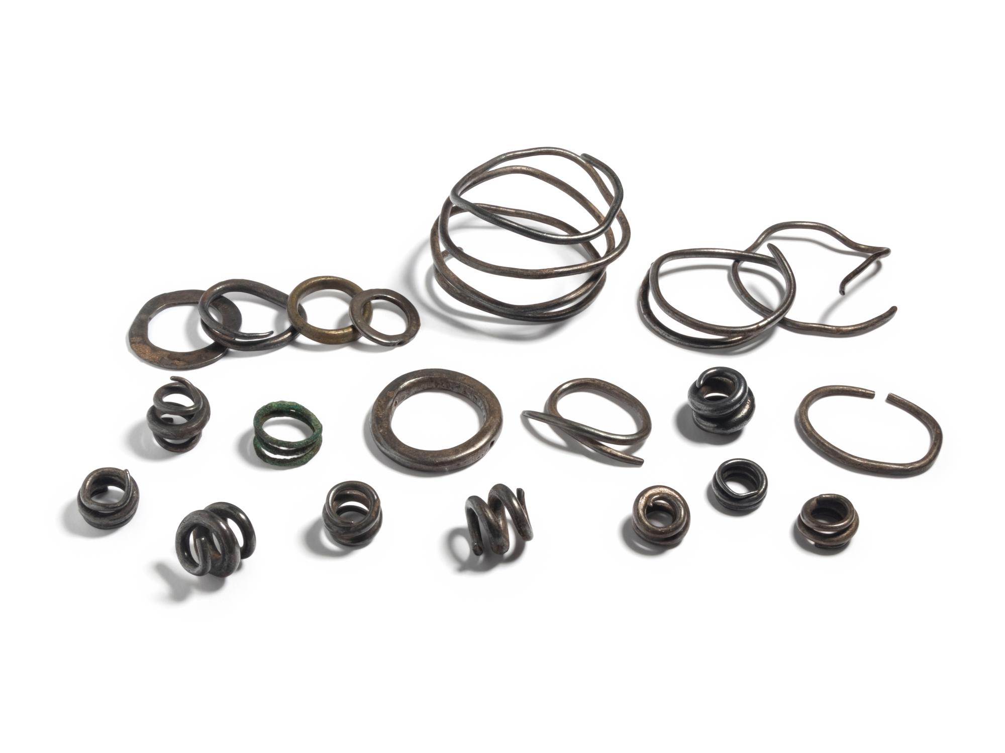 A Collection of European Bronze Age Jewelry — (solid silver hair rings and arm bands)