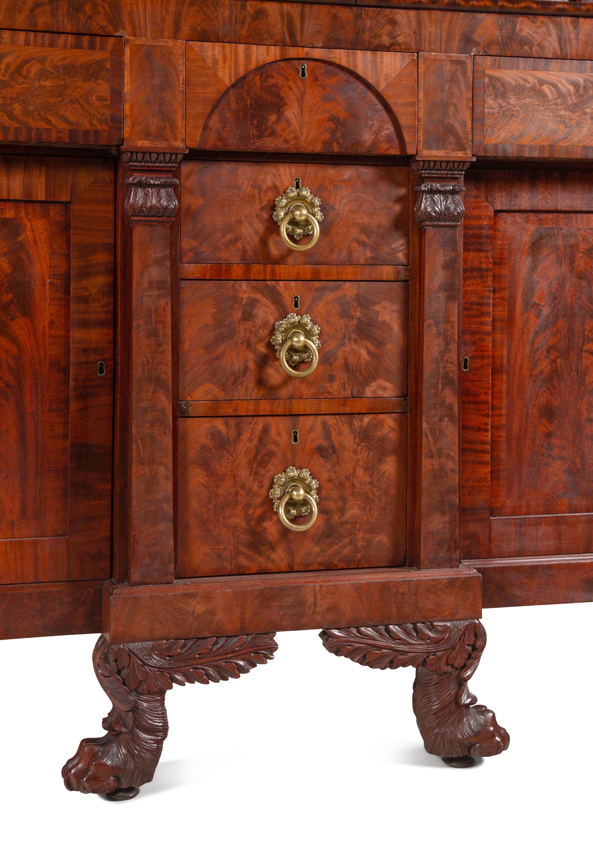 A Late Classical Carved and Highly Figured Mahogany Sideboard