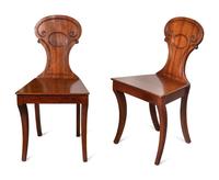 A Pair of Regency Style Mahogany Hall Chairs