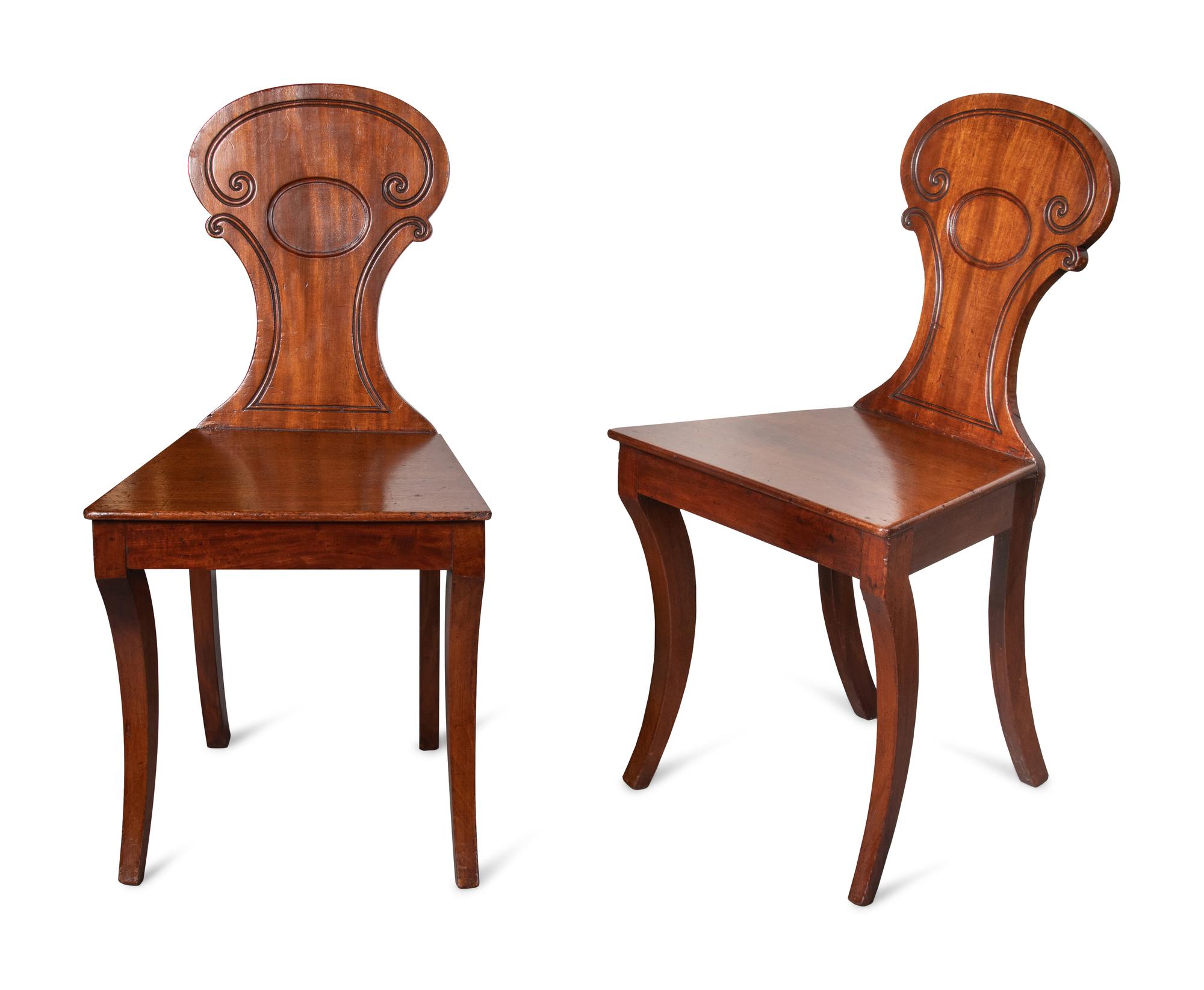 A Pair of Regency Style Mahogany Hall Chairs