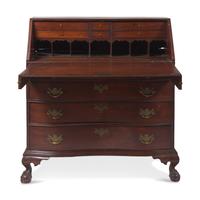 A Chippendale Carved Mahogany Oxbow Slant-Front Desk