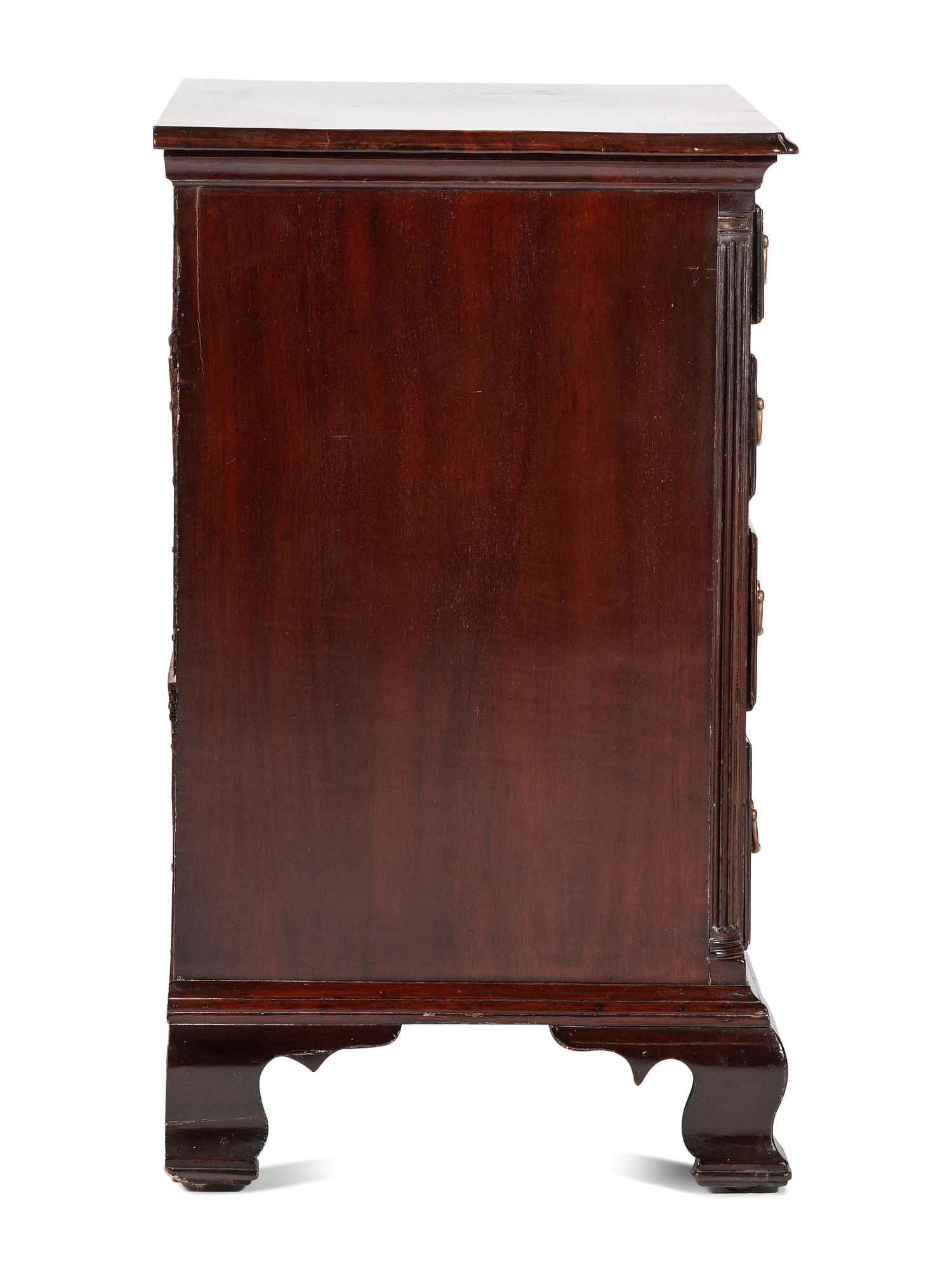 A Chippendale Carved and Figured Mahogany Chest of Drawers