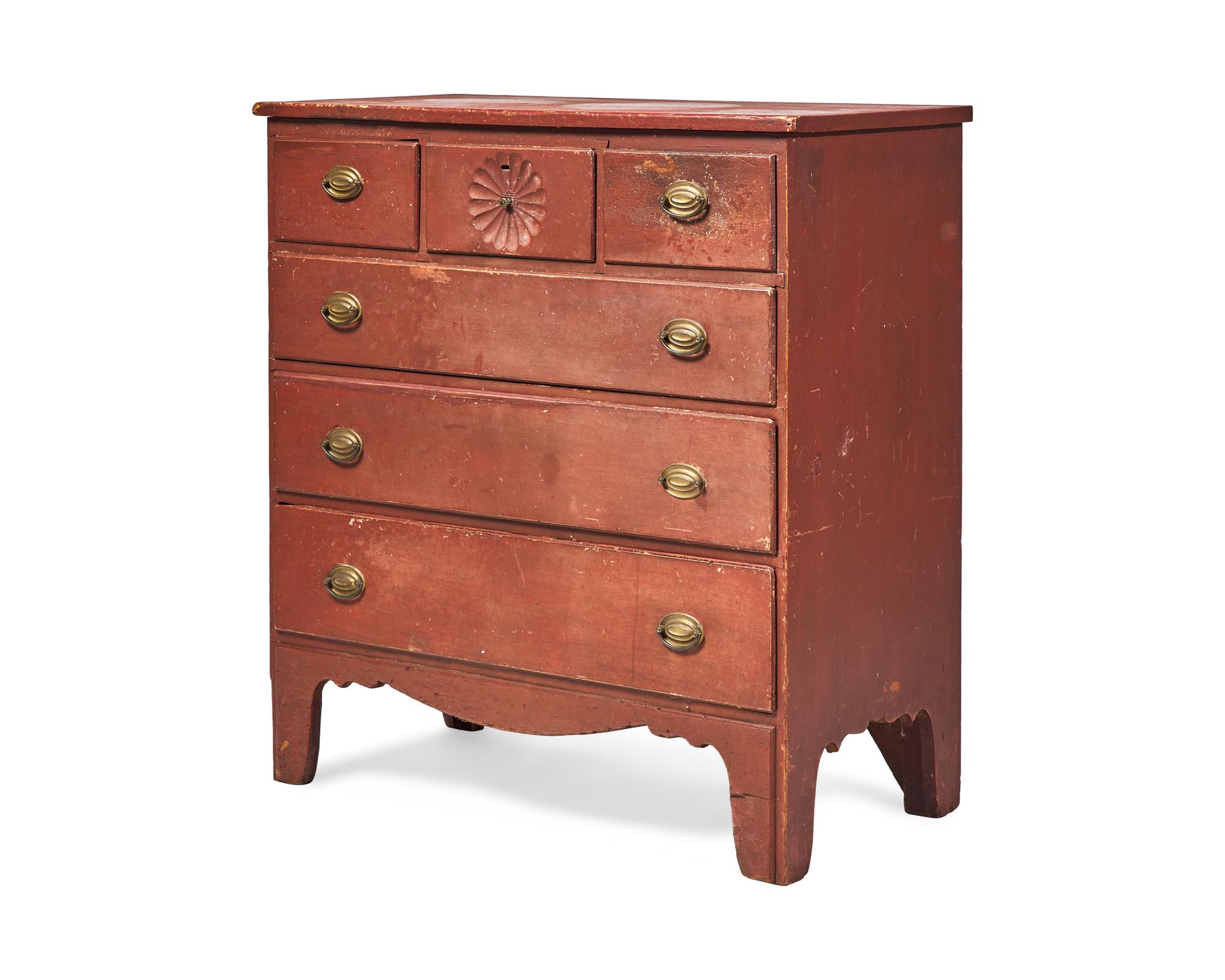 A Chippendale Carved And Red-Painted Chest Of Drawers