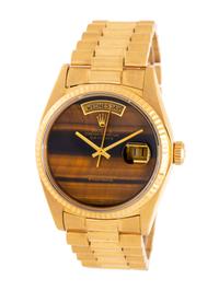 ROLEX, REF. 18038 18K YELLOW GOLD 'DAY-DATE' 'SINGLE QUICKSET' WATCH, WITH RARE TIGER'S EYE DIAL, BOX & BOOKLETS