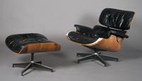 A Charles and Ray Eames Lounge Chair and Ottoman, Herman Miller, Height 36 x width 24 x depth 11 1/2 inches.