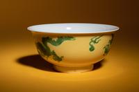 A Green Enameled Yellow Ground Porcelain 'Dragon' Bowl
