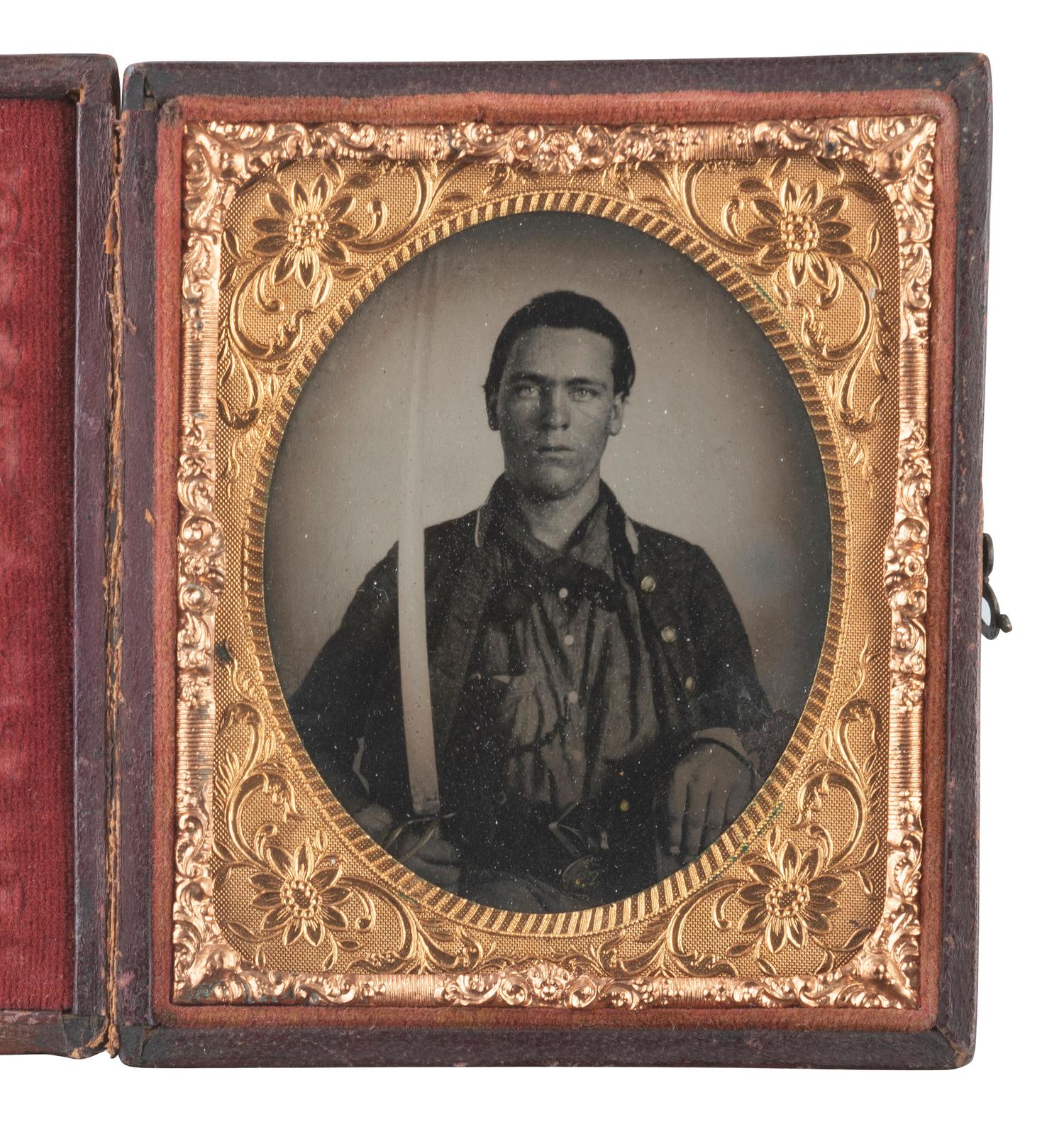 [CIVIL WAR]. Sixth plate tintype of an armed CSA soldier wearing the Alabama "Map on Tree" belt buckle.
