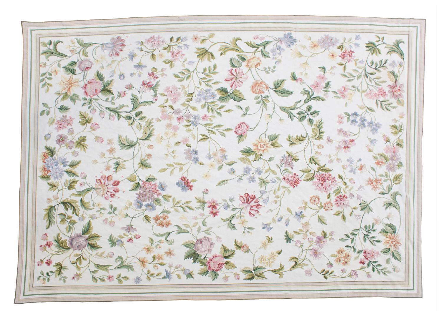 A Floral Needlepoint Rug 8 feet 10 inches x 11 feet 8 inches. — 20TH CENTURY
