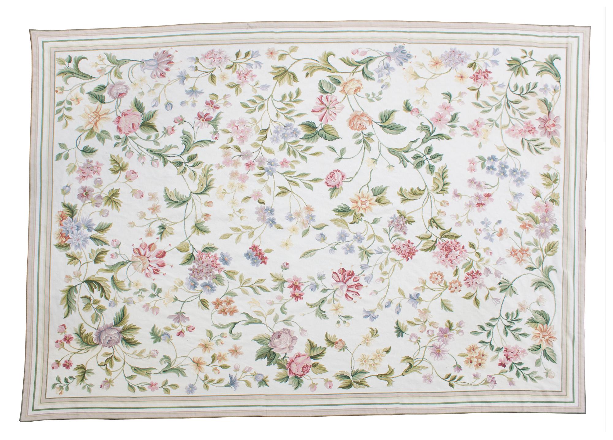 A Floral Needlepoint Rug 8 feet 10 inches x 11 feet 8 inches. — 20TH CENTURY