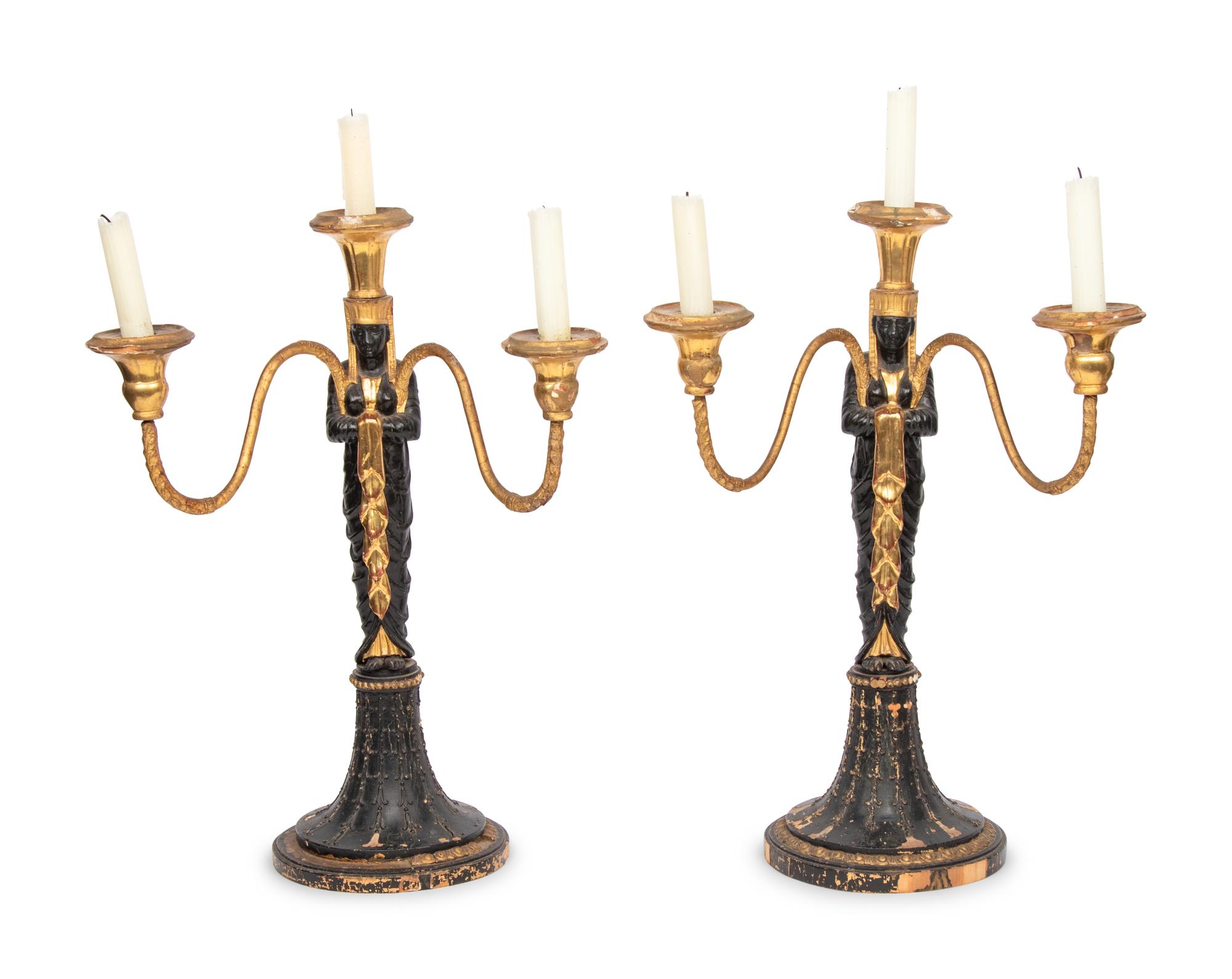 A Pair of Empire Style Painted and Parcel Gilt Candelabra