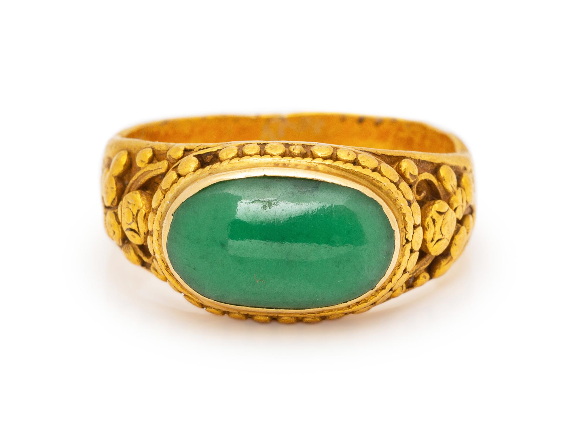A High Karat Yellow Gold and Jade Ring,