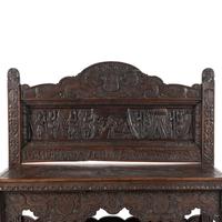 An Elizabethan Style Carved Oak Three-Tier Server