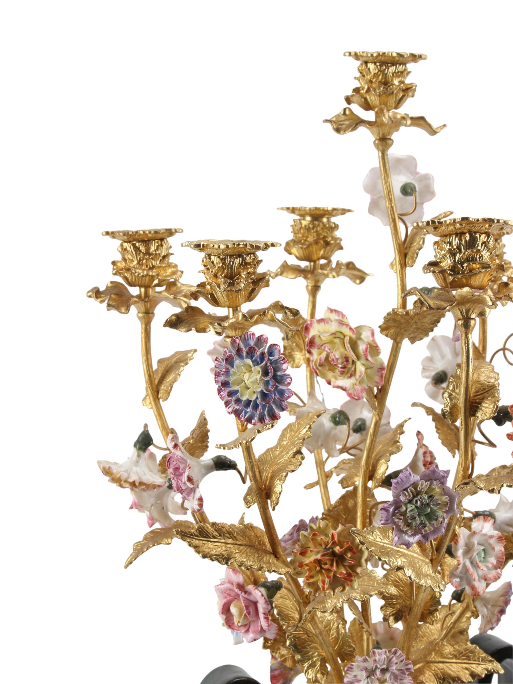 A Pair of Large Continental Porcelain and Gilt Bronze Seven-Light Candelabra