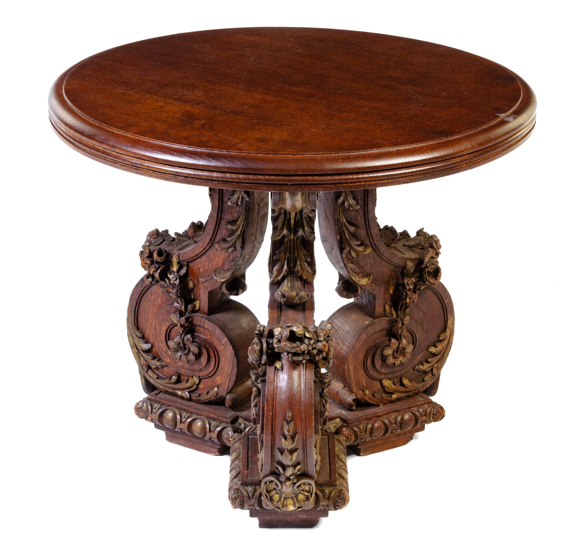 An Italian Carved Oak Table Height 26 3/4 x diameter of top 31 inches. — 19TH CENTURY