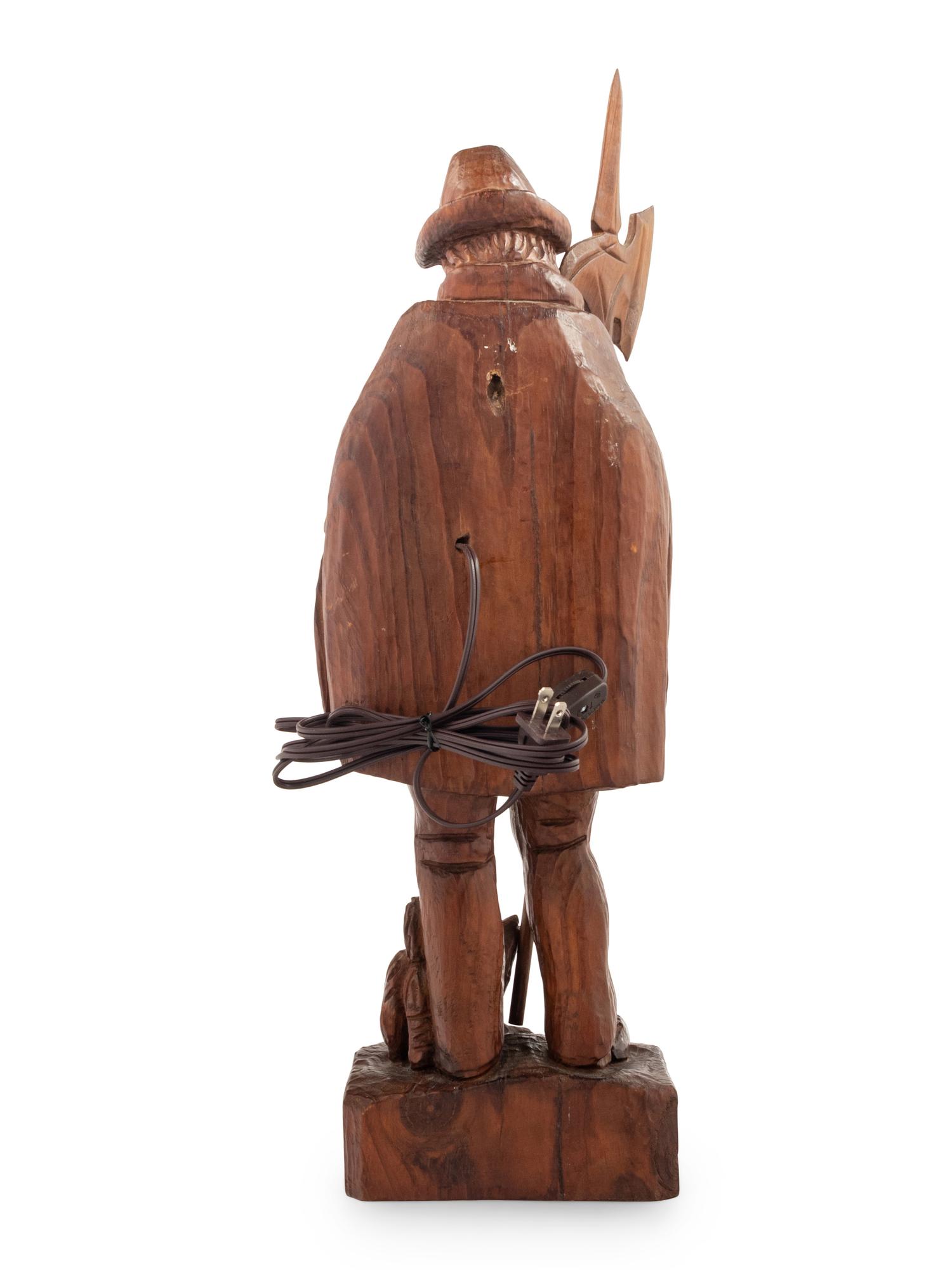A Black Forest Carved Walnut 'Night Watchman' Lamp