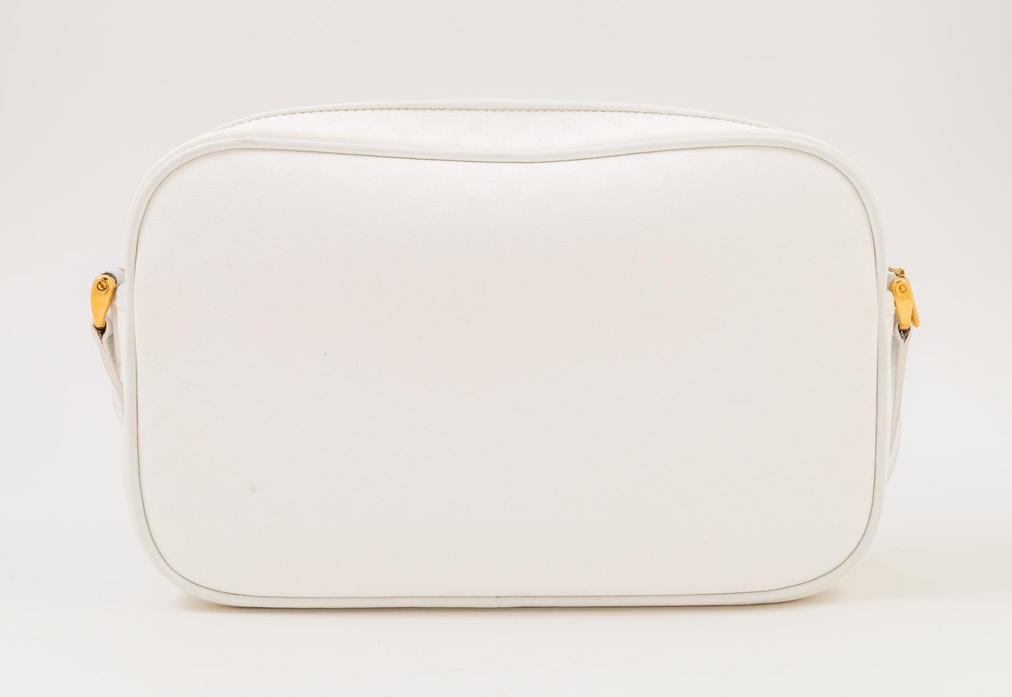 A Gucci White Monogram Canvas Handbag, 10" x 6.5" x 3"; Strap drop: 19".