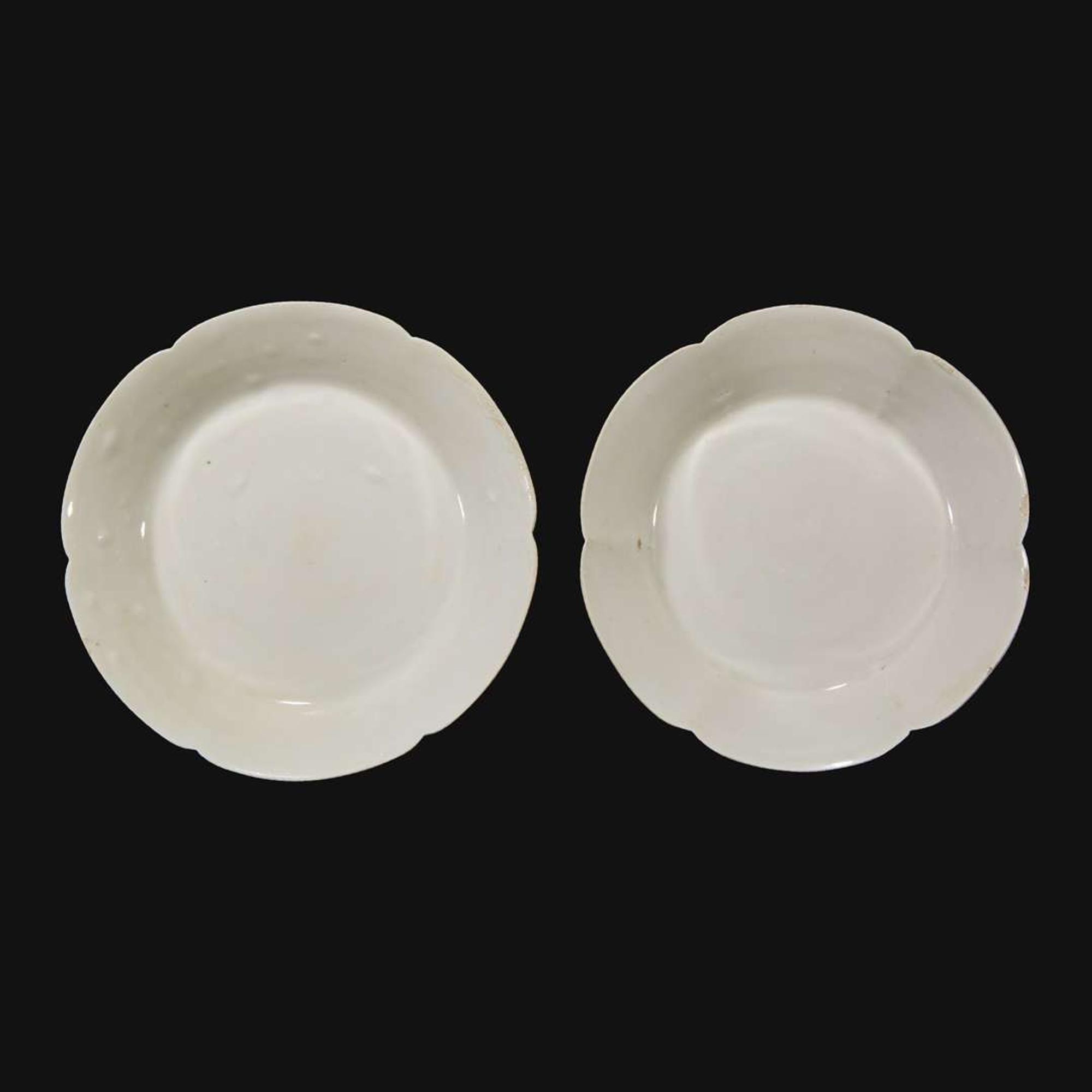 An associated pair of Chinese whiteware floriform dishes Song dynasty