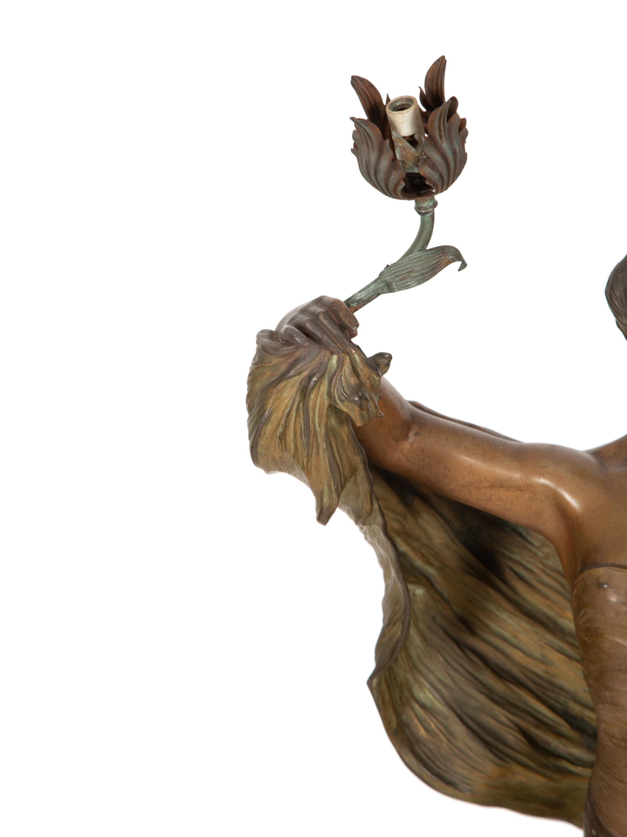 A Patinated Metal Figure of a Standing Maiden Mounted as a Lamp