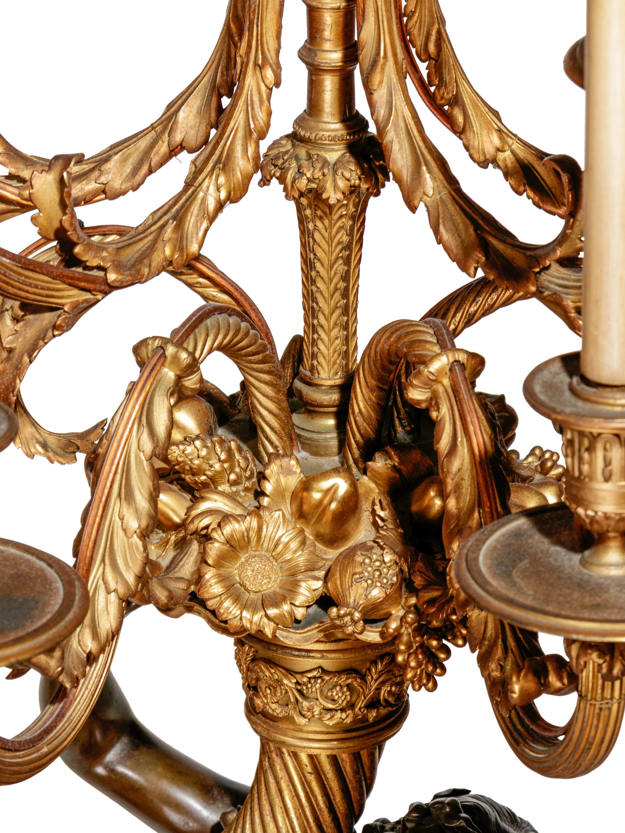 A Pair of Large Gilt and Patinated Bronze Figural Nine-Light Candelabra after the Models by Clodion
