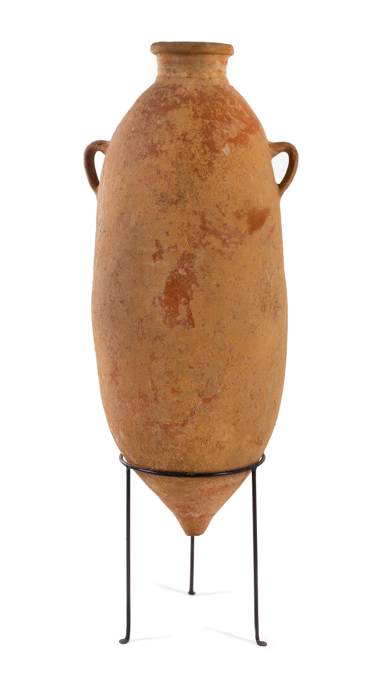 A Roman Terra Cotta Transport Amphora Height 48 inches. — CIRCA 1ST CENTURY C.E.