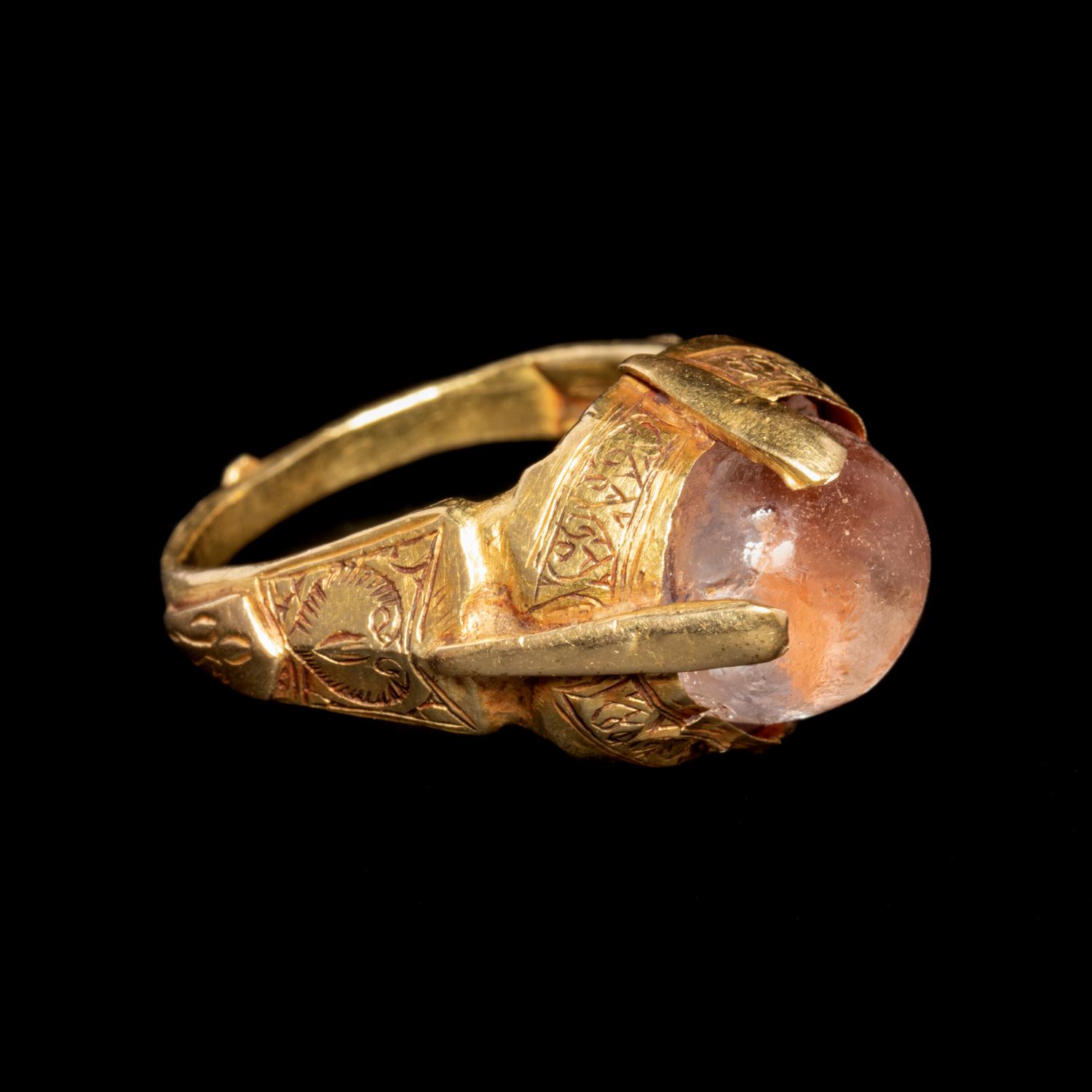 An Islamic Gold Finger Ring with Rock Crystal Cabochon